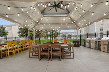 Covered outdoor dining pavilion with string lights